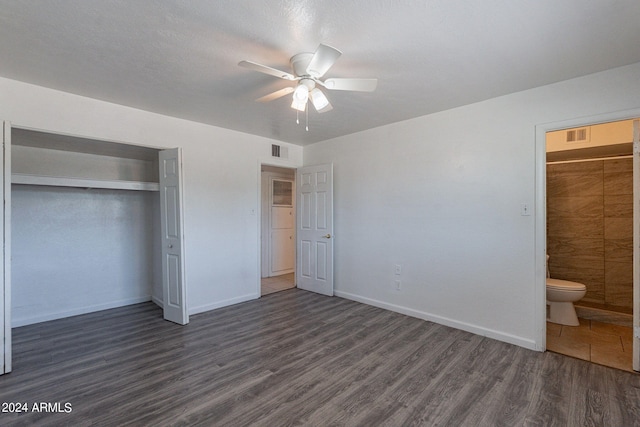 3115 N 55th Ave, Phoenix, AZ 85031 - unfurnished bedroom featuring dark wood-type flooring, a closet, a ceiling fan, and connected bathroom