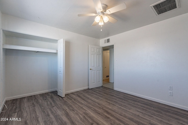 3115 N 55th Ave, Phoenix, AZ 85031 - unfurnished bedroom featuring dark wood-style flooring, ceiling fan, and a closet