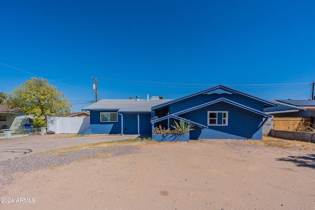 3115 N 55th Ave, Phoenix, AZ 85031 - view of front facade with concrete driveway and concrete block siding