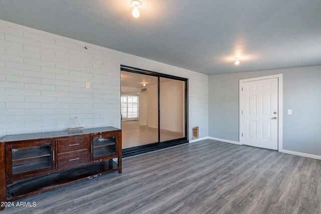 3115 N 55th Ave, Phoenix, AZ 85031 - unfurnished living room with dark wood finished floors and baseboards