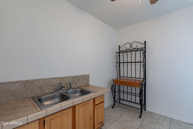 3115 N 55th Ave, Phoenix, AZ 85031 - kitchen featuring a ceiling fan, tile countertops, and light tile patterned floors