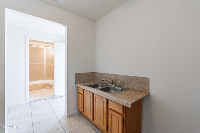 3115 N 55th Ave, Phoenix, AZ 85031 - kitchen with tile countertops and light tile patterned flooring
