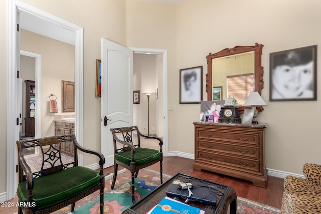 sitting room featuring dark wood-type flooring