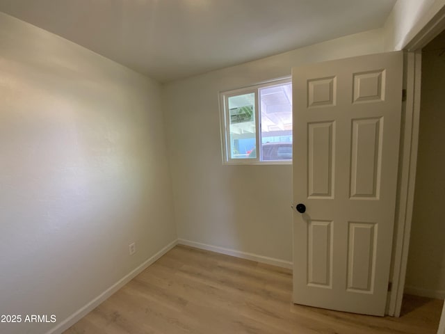 unfurnished room featuring light wood-type flooring