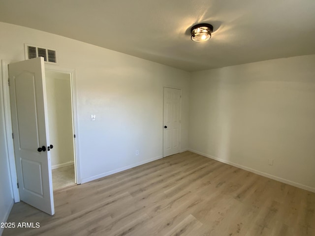 unfurnished room featuring light hardwood / wood-style flooring