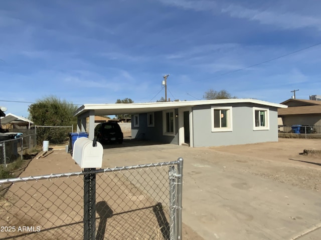 view of front of home with a carport