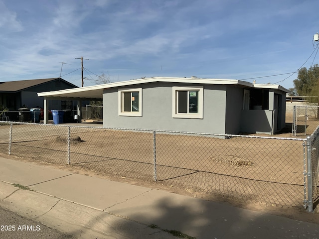 view of front of property with a carport