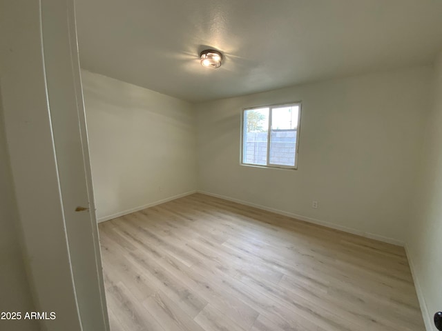 empty room with light wood-type flooring