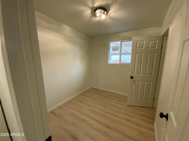 unfurnished room featuring light wood-type flooring