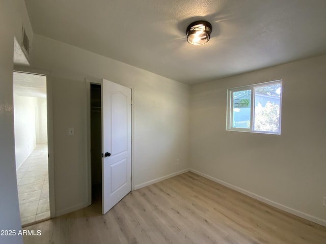 empty room with light wood-type flooring