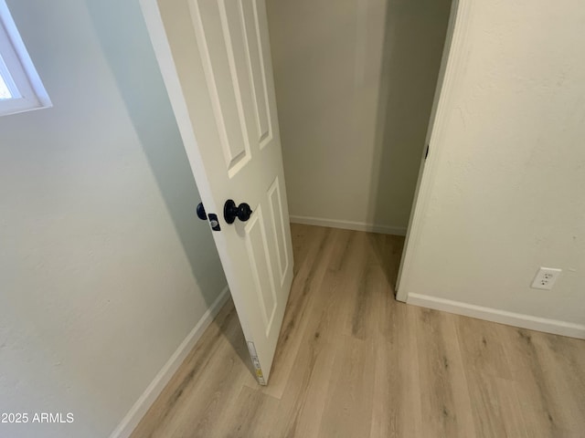 corridor featuring light wood-type flooring