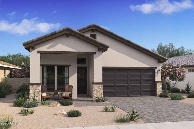 view of front of home featuring decorative driveway, stucco siding, an attached garage, stone siding, and a tiled roof