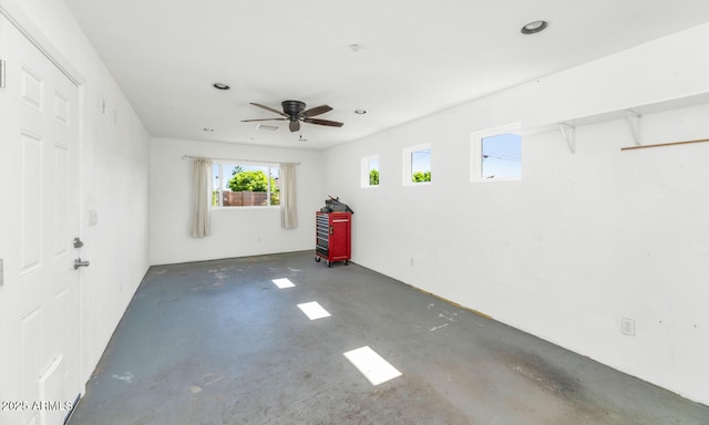 8140 E Mitchell Dr, Scottsdale, AZ 85251 - empty room featuring unfinished concrete floors, healthy amount of natural light, ceiling fan, and recessed lighting