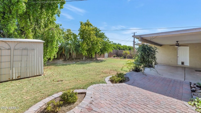 8140 E Mitchell Dr, Scottsdale, AZ 85251 - fenced backyard with ceiling fan, a shed, and a patio area