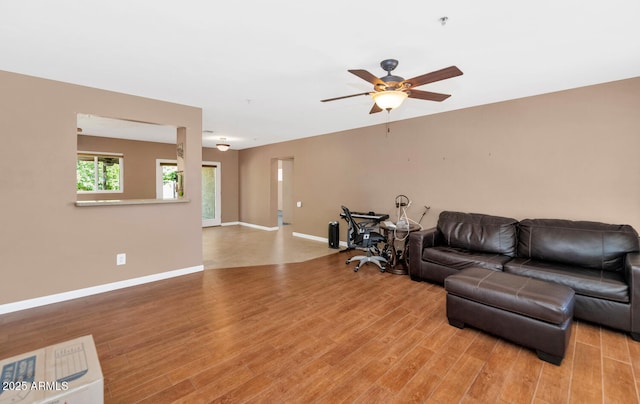 8140 E Mitchell Dr, Scottsdale, AZ 85251 - living room featuring light wood-type flooring and a ceiling fan