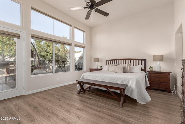 bedroom featuring hardwood / wood-style floors and ceiling fan