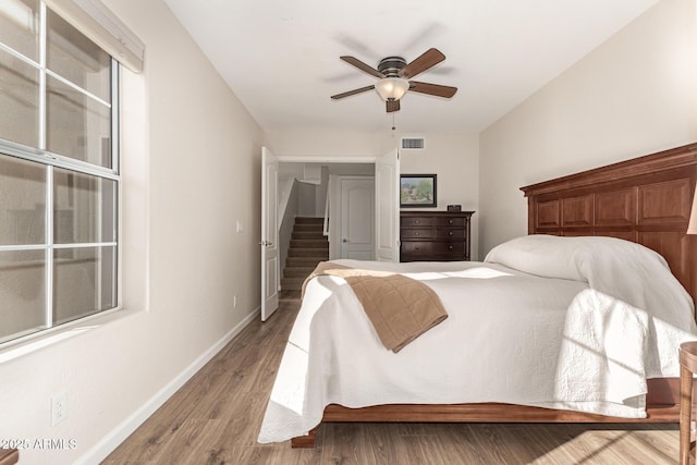 bedroom featuring ceiling fan and hardwood / wood-style flooring