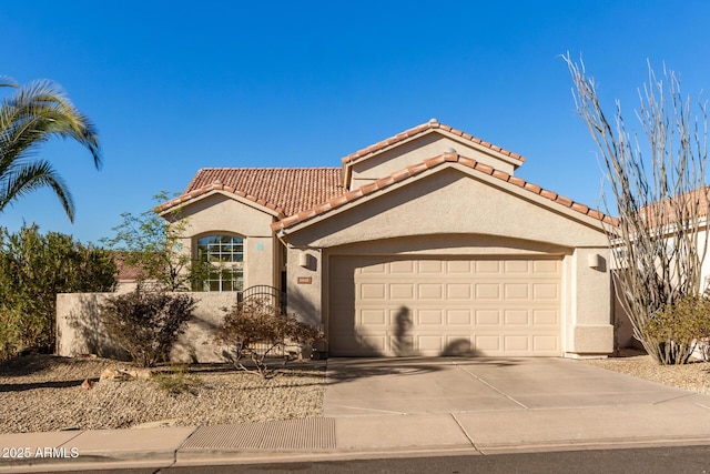 mediterranean / spanish-style home featuring a garage