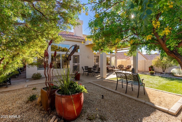 exterior space with an outdoor hangout area and a patio