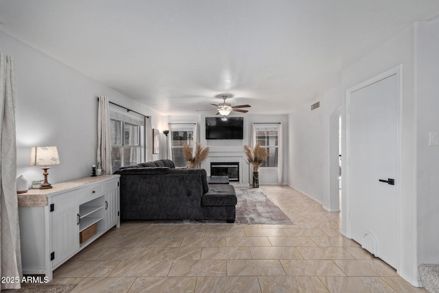 4049 E Arbor Ave, Mesa, AZ 85206 - living area with a ceiling fan and a glass covered fireplace
