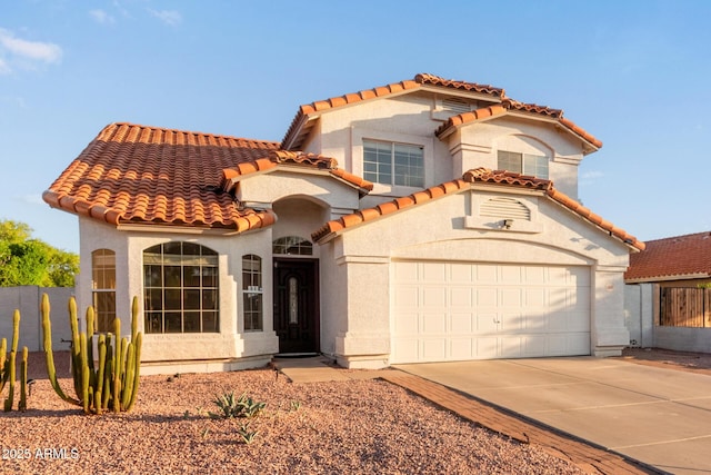 4049 E Arbor Ave, Mesa, AZ 85206 - mediterranean / spanish home with driveway, stucco siding, a tile roof, and a garage