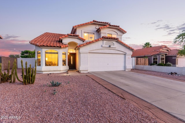 4049 E Arbor Ave, Mesa, AZ 85206 - mediterranean / spanish-style home with driveway, an attached garage, stucco siding, and a tile roof