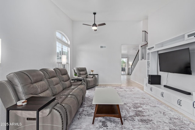 4049 E Arbor Ave, Mesa, AZ 85206 - living room featuring a high ceiling, a ceiling fan, stairway, and baseboards