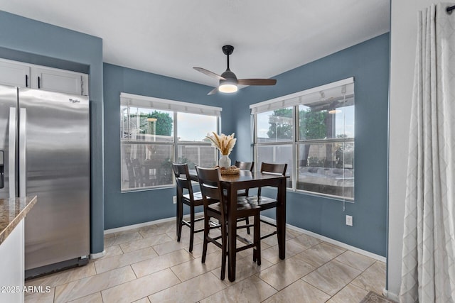 4049 E Arbor Ave, Mesa, AZ 85206 - dining room featuring baseboards, ceiling fan, and light tile patterned floors