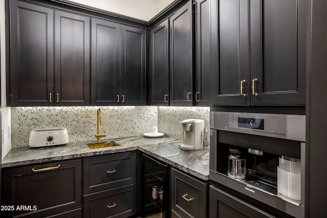 interior space with tasteful backsplash, oven, sink, and light stone counters