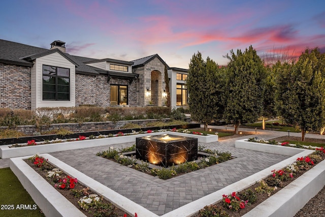 exterior space featuring an outdoor fire pit