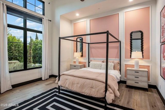 bedroom with light hardwood / wood-style flooring