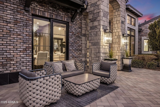 patio terrace at dusk with an outdoor living space