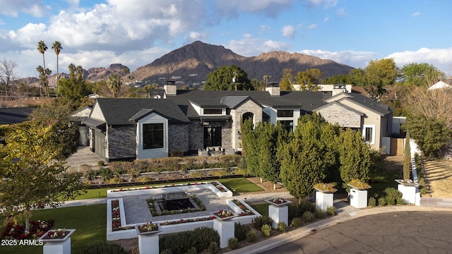 view of front of home with a mountain view