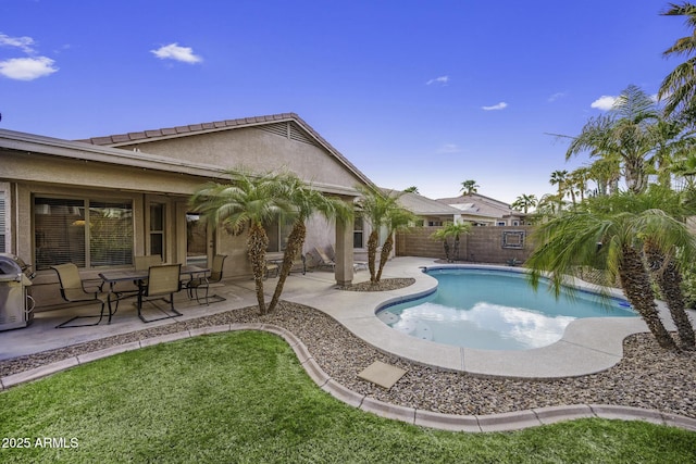 view of pool with a yard, a fenced in pool, a fenced backyard, and a patio area