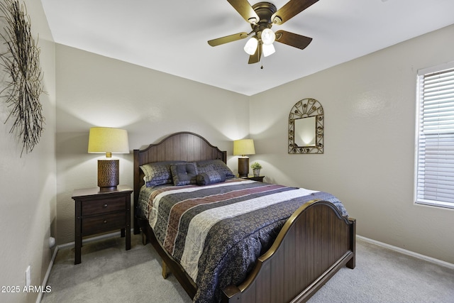 bedroom featuring ceiling fan, carpet flooring, and baseboards