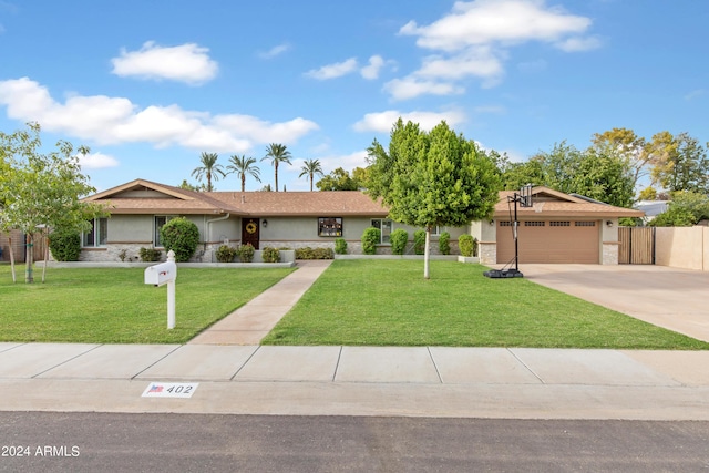 single story home featuring a garage and a front lawn