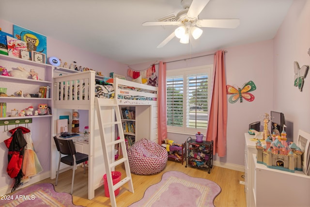 bedroom with light hardwood / wood-style flooring and ceiling fan