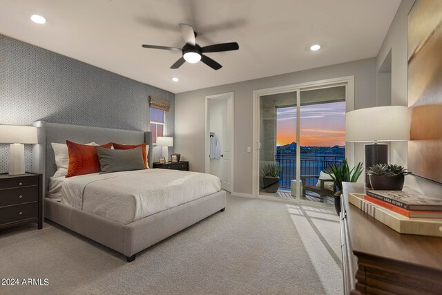 bedroom with recessed lighting, light colored carpet, an accent wall, access to outside, and wallpapered walls