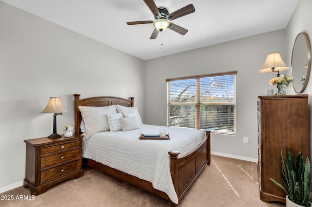 bedroom with baseboards, a ceiling fan, and light colored carpet