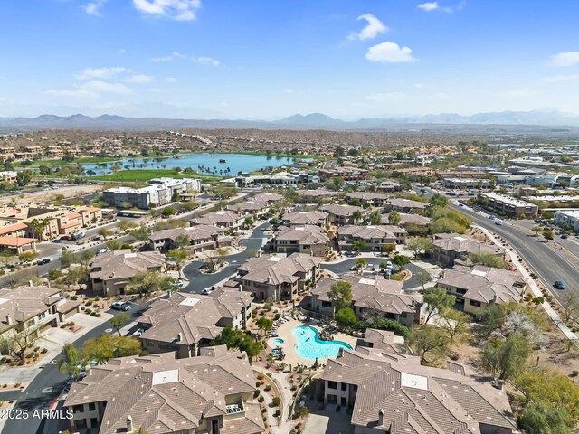 birds eye view of property featuring a residential view and a water and mountain view