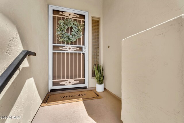 property entrance featuring stucco siding