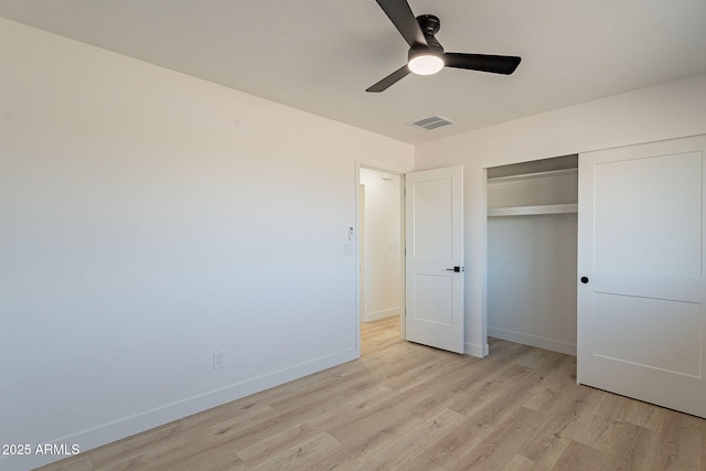 unfurnished bedroom featuring light wood finished floors, baseboards, and visible vents