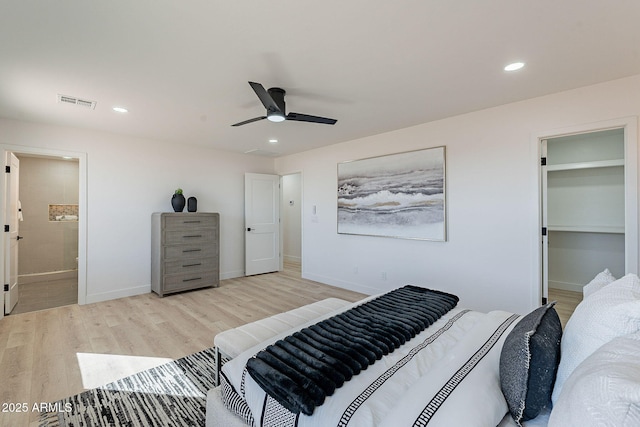 bedroom with light wood-type flooring, visible vents, baseboards, and recessed lighting