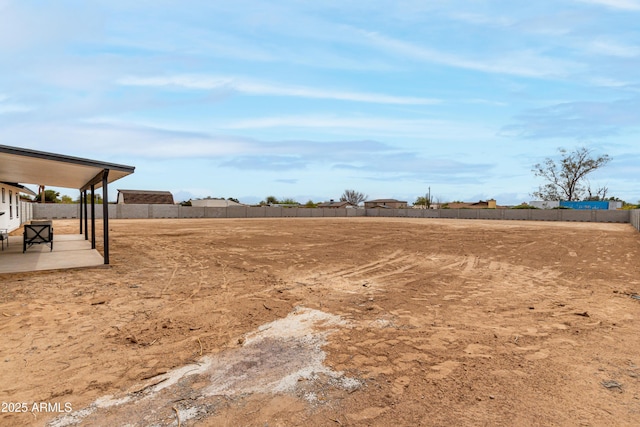 view of yard with a patio and fence