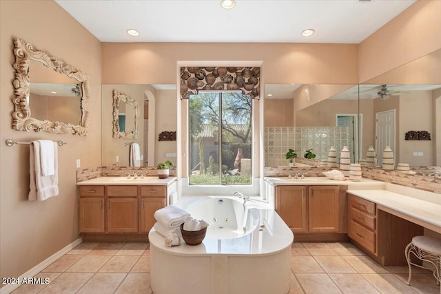 bathroom featuring a tub to relax in, backsplash, vanity, and tile patterned floors