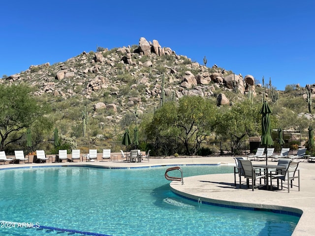 view of swimming pool with a patio area