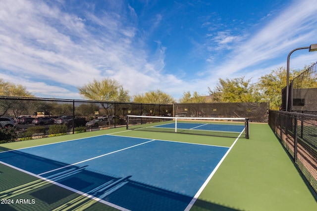 view of tennis court featuring basketball court