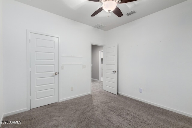 unfurnished bedroom featuring carpet floors and ceiling fan