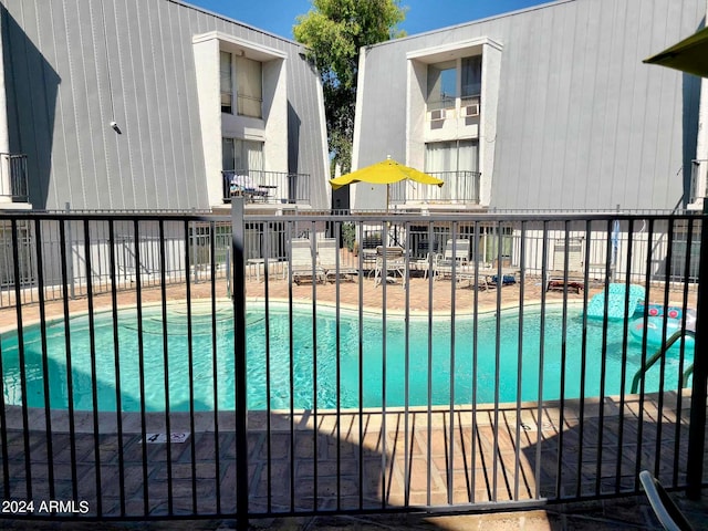 view of swimming pool featuring a patio area