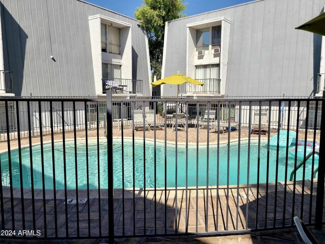 3416 N 44th St Unit 5, Phoenix, AZ 85018 - community pool with fence and a patio